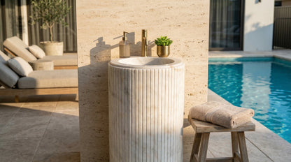 Marble-standing sink by a poolside with outdoor furniture in the background Carrara White Marble Designer Pedestal Stand-Alone Fluted Sink (W)18" (L)18" (H)33"