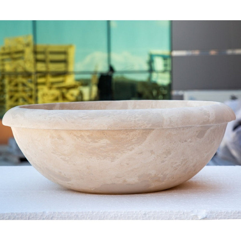 Beige travertine round drop-in sink NTRSTC03 D16 H6 side view