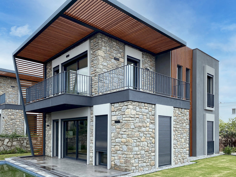 everest coffee grey manufactured stone siding 317887 side view of the house balcony